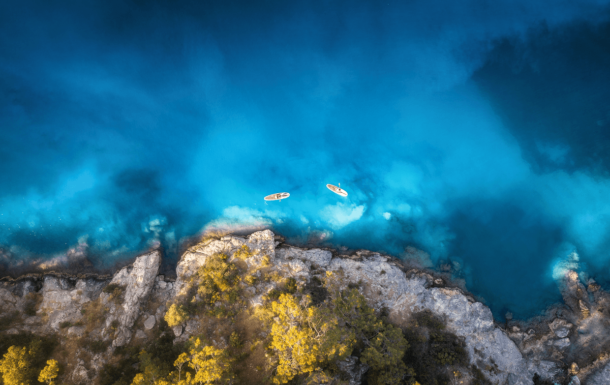 Arial view of people on floating kayaks