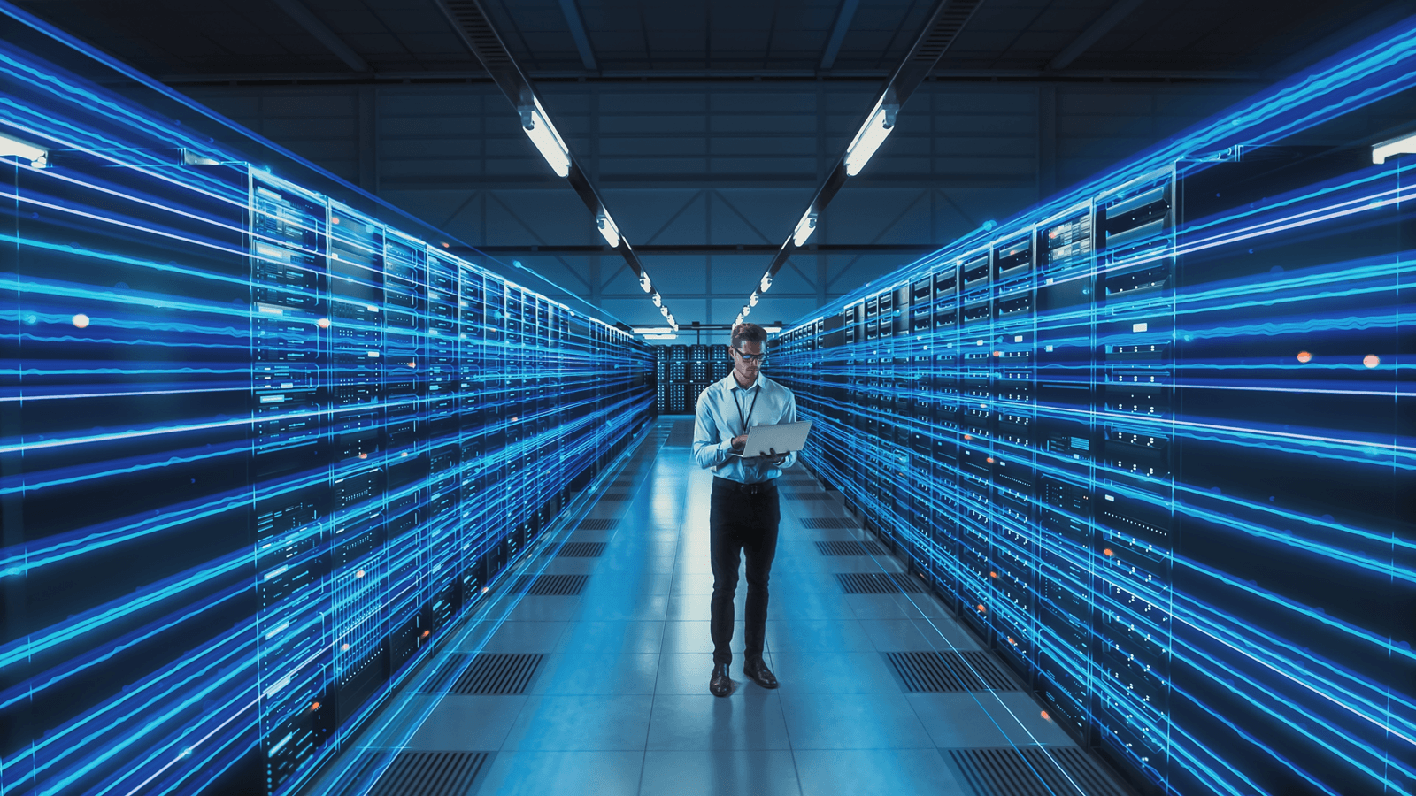 Technician in a modern data center server aisle