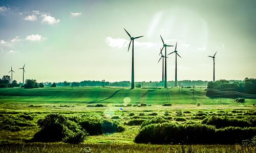 Field with wind turbine