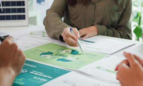 Closeup group of businesspeople talk ESG strategies