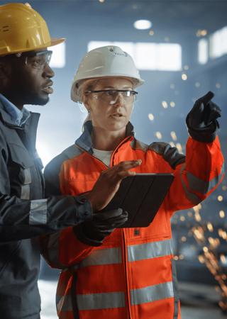 Industrial professionals reviewing operations and safety procedures