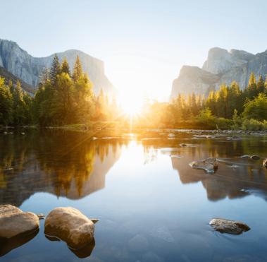 View of the river with the sun over the mountains