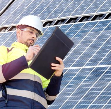 Attractive engineer installing solar panels and clean energy